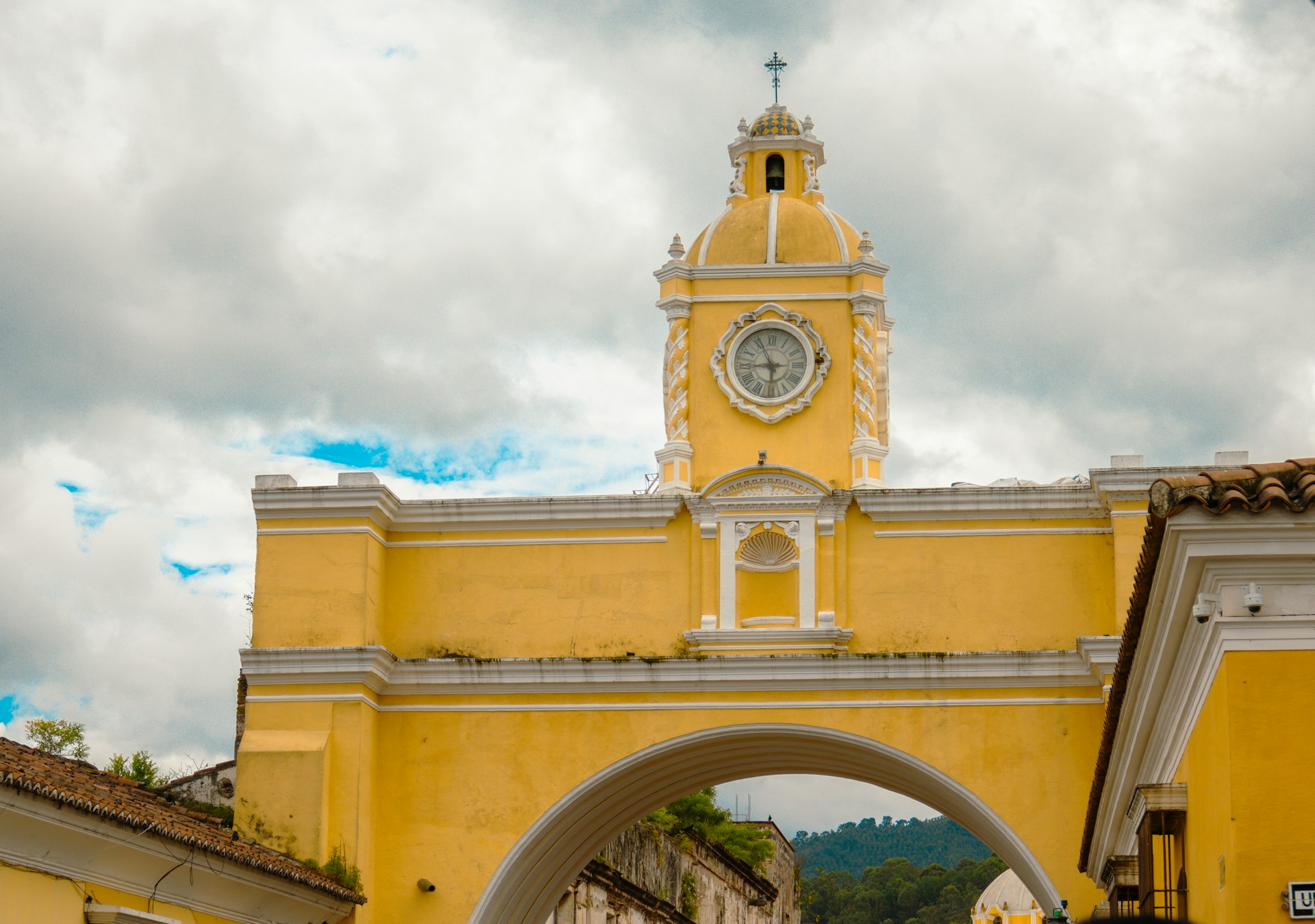 A large yellow building with a clock tower